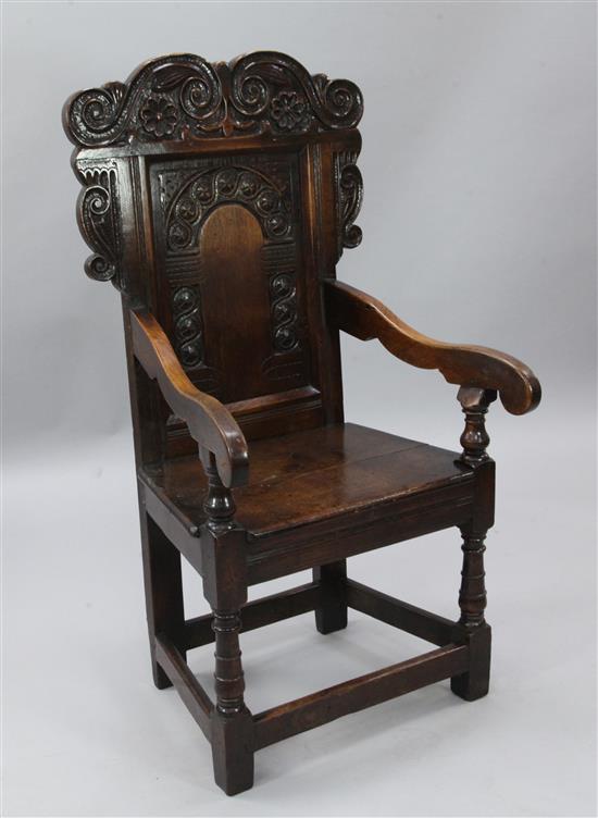 An early 18th century style Welsh oak joined armchair, W.2ft H.3ft 11in.
